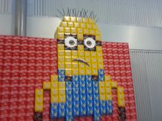 a lego minion is made to look like it has been placed on the wall