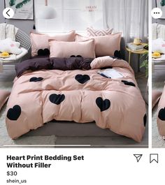 a pink bed with black hearts on it