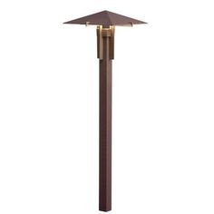 an outdoor post light that is brown and has two lights on each side of it