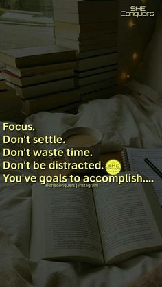 an open book sitting on top of a bed next to a pile of books with the words focus don't waste time don't be distracted you've goals to accomplish