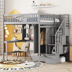 a loft bed with desk underneath it in a room that has yellow walls and hardwood floors