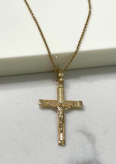 Item Specifications Handmade Yellow Gold A timeless symbol of faith and redemption. This crucifix cross is beautifully crafted in 14k yellow gold.  Whether for a baptism, confirmation, wedding, or as a thoughtful gesture of sympathy and support, our crucifix cross makes a meaningful and cherished gift for loved ones.  Cross Measurements : 31mm (With Bail) Height x 16.50mm Width Metal : 14k yellow gold Chain Style: 0.90mm Cable 18" Long Closure: Spring Ring Country Of Manufacturing------------- *USA Michigan* Shop at Gabriana Jewelers with confidence. We've been in jewelry making business for over 35 years.Each and every one of our items are made with special care by a skilled professional, and we guarantee all our customers satisfaction. Customers would come to us with very rough ideas ,ev Jewelry Making Business, Cross Jesus, Country Rings, Timeless Symbol, Luxury Gift Box, Jesus On The Cross, Yellow Gold Chain, Jewelry Manufacturers, Solid Yellow