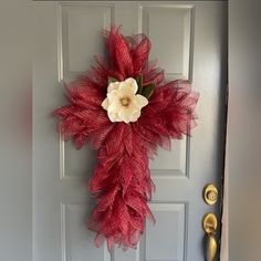 a red door with a white flower on it