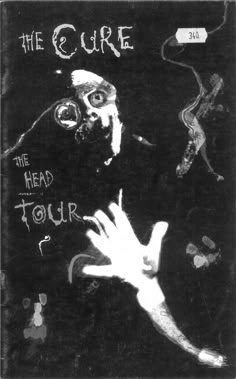 a black and white photo of a man holding his hand up to the camera with words on it