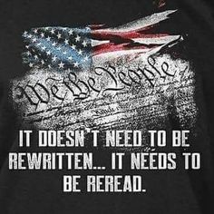 the back of a black shirt with an american flag and words written in white on it