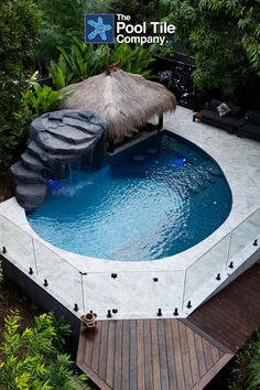 an above ground swimming pool surrounded by greenery