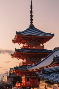 the pagodas are all different colors and sizes, but one is red in color