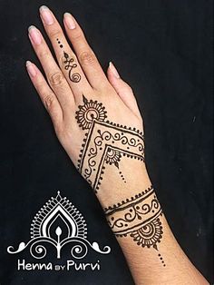 henna tattoo designs on the hand and wrist for women with intricate patterns, black background