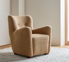 a brown chair sitting on top of a white rug