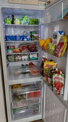 an open refrigerator filled with lots of food