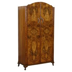 an antique wooden armoire with two doors