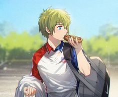 a man with green hair eating a hot dog in front of trees and grass on a sunny day