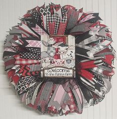 a wreath made out of fabric with the words welcome to the farm on it