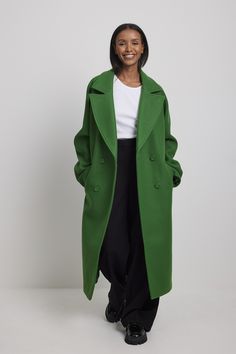 This coat features a midi length, a double-breasted button closure, button cuffs, front pockets and a back slit detail. Colorful Coat Outfit, Green Coat Outfit, High Neck Coat, Oversized Faux Fur Coat, Biker Look, Mode Mantel, Black Outerwear, Checkout Page