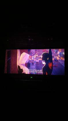 a television screen with an animated character on it's display in a dark room