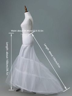 a white wedding dress on a mannequin with measurements for the bust and skirt