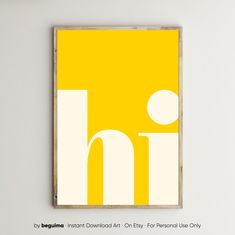 a yellow and white poster hanging on the wall