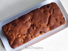 a loaf of chocolate chip bread on a white platter