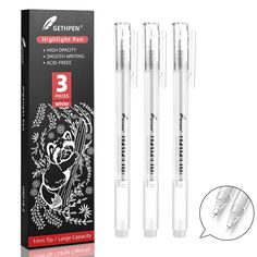 three white pens sitting next to each other in front of a box with an image of a koala on it