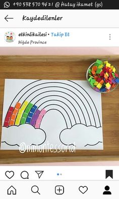 a wooden tray topped with rainbows and gummy bears