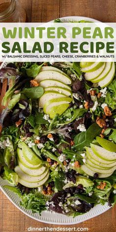 winter pear salad recipe with walnuts, spinach and feta cheese on a white plate