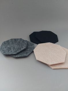 three pieces of felt sitting on top of a table