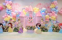 a birthday party with princess decorations and balloons