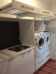 a washer and dryer in a small room