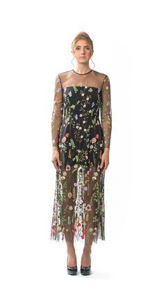 Sheer Embroidered Floral Long Column Dress with Long Sleeves and Attached Black Lining.  Dress has slightly flared hemline and Centre-back invisible zipper closure.  Dry Clean Only. All dresses are individually-made in Vancouver, Canada.  Dresses ship within 2 weeks of an order being placed. Fabric is 100% Polyester Embroidered Tulle.  Lining is 95% Polyester/5% Spandex. Dress is available in four sizes: XSMALL, SMALL, MEDIUM, and LARGE. Model is 5'10, 125lbs, and is wearing a size SMALL. X-SMAL Spring Garden Party Dress With Back Zipper, Floor-length Floral Embroidery Cocktail Dress, Floor-length Floral Embroidered Cocktail Dress, Spring Maxi Dress With Intricate Embroidery For Party, Spring Maxi Dress With Intricate Embroidery, Spring Fitted Maxi Dress With Intricate Embroidery, Spring Party Maxi Dress With Intricate Embroidery, Embroidered Floor-length Dress For Garden Party, Floor-length Embroidered Dress For Garden Party