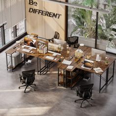 an office with desks and chairs in front of a sign that says be different