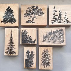 six rubber stamps with trees on them, all in different shapes and sizes are placed next to each other