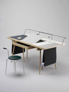 an office desk with two chairs and a table