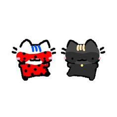 two black cats with red spots on their faces