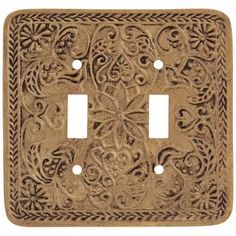 a decorative light switch cover with an intricate design