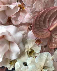 pink and white flowers are arranged together