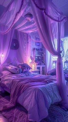 a bed with purple sheets and curtains in a room that is lit up at night