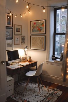 a home office with lights strung from the ceiling