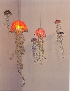 several jellyfish lights hanging from the ceiling