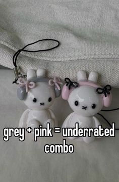 two small white teddy bears sitting next to each other on top of a bed with the caption grey + pink = underrateded combo