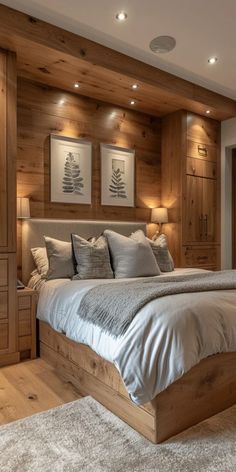 a large bed sitting in the middle of a bedroom next to a wooden headboard