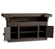 an entertainment center with two drawers and one door open on the side, in dark wood