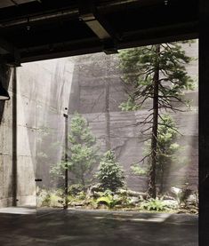 an empty parking garage with trees in the background