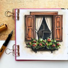 an open book with a drawing of a window and flowers in the window sill