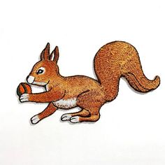 a drawing of a squirrel holding an orange ball in its paws, on a white background