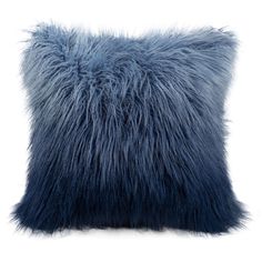 a blue pillow with long fur on it's sides and the bottom part of the pillow