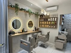 a hair salon with chairs and mirrors on the wall