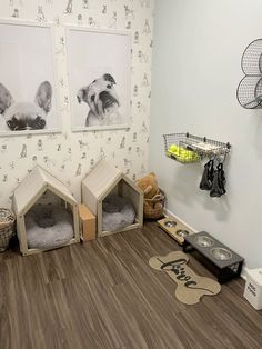 a dog's kennel is shown with two pictures on the wall