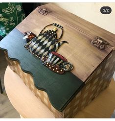 a wooden box sitting on top of a table