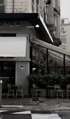 an empty street with tables and chairs on it