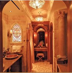 a fancy bathroom with stained glass windows